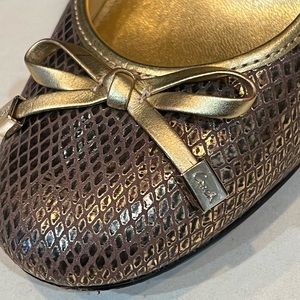 Women Coach shoes, closed toe gold wedge